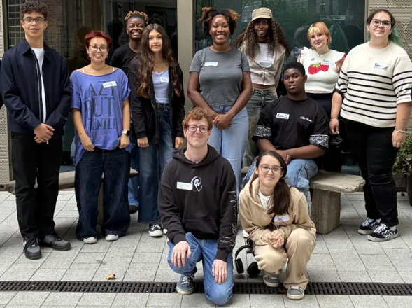 A group of people looking at the camera